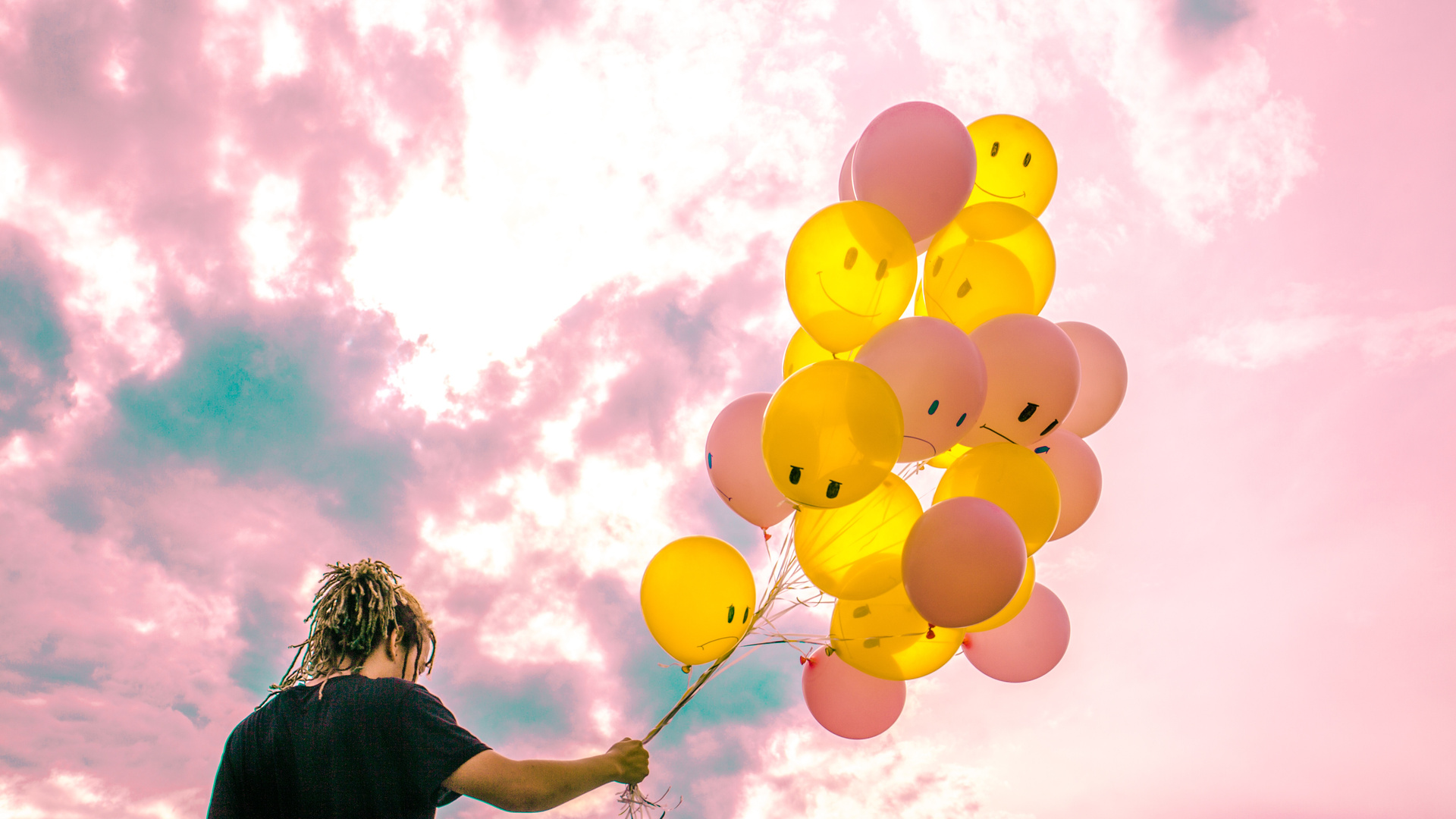 Boy With Happy And Sad Balloons