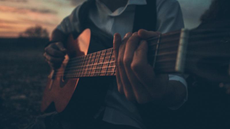 Boy Playing Guitar Outdoors 5k
