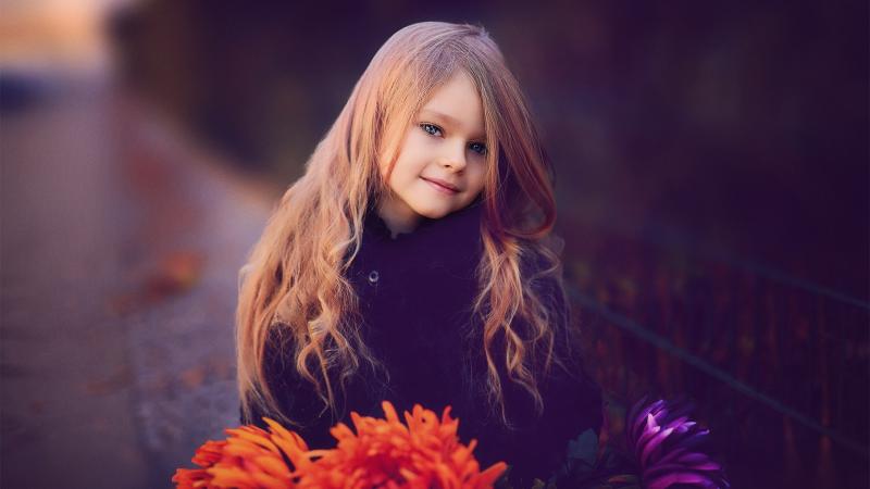 Cute Little Girl With Flowers