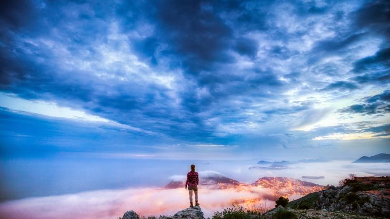 Girl On A Ledge Overlooking