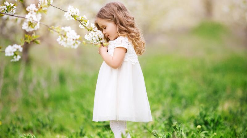 Little Cute Girl Smelling Flowers - Wallpaper Download