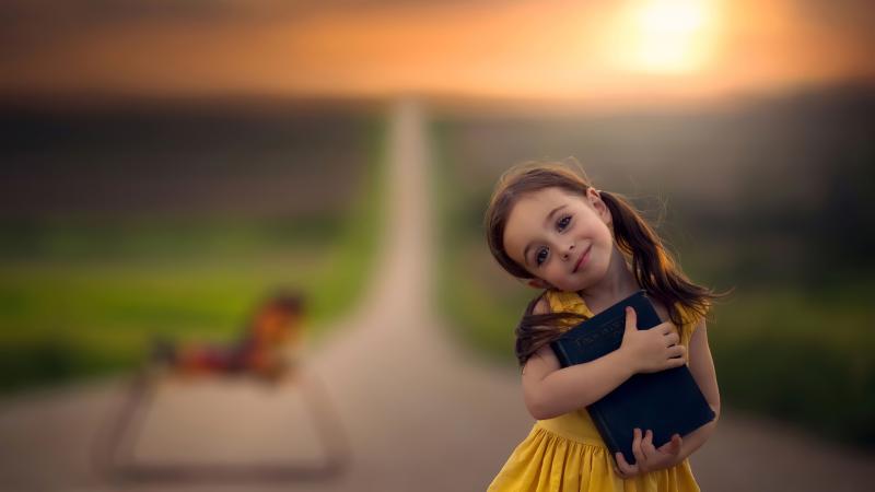 Little Cute Girl With Book