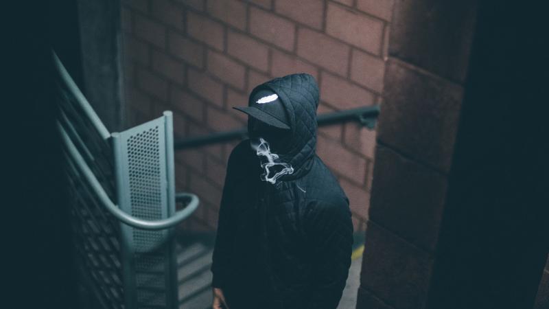 Man In Hood Smoking