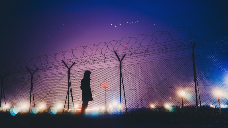 Night Lights Person Standing Behind Fence Silhouetee