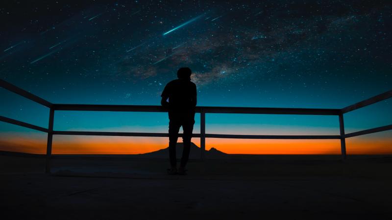 Person Silhouette Meteors Night Sky 8k
