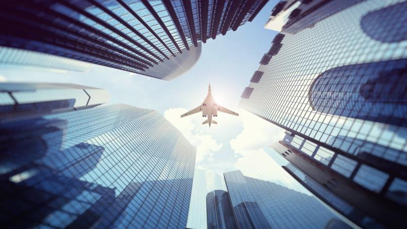 Plane Over Building