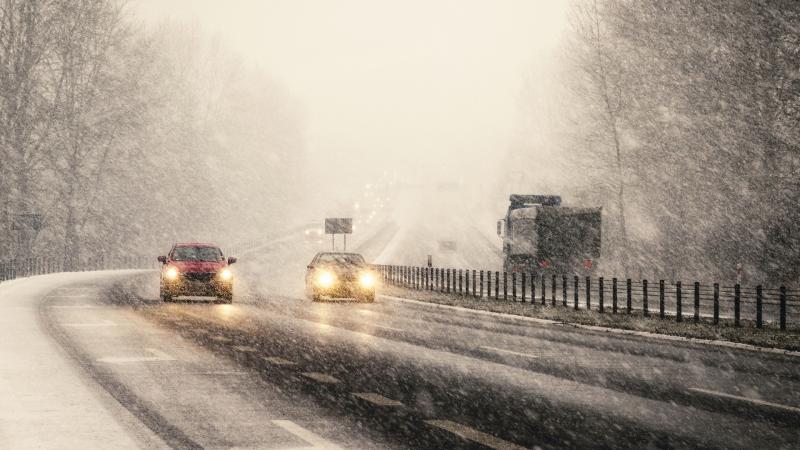 Snowstorm On Highway Vehicles