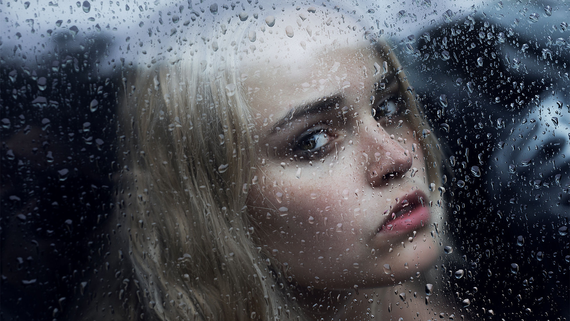 Girl Behind The Glass With Water Drops