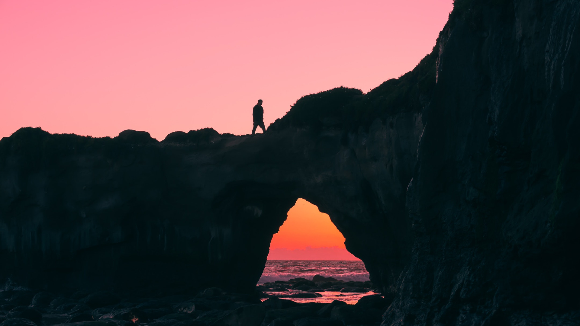 Man Walking Over Rock Silhouette