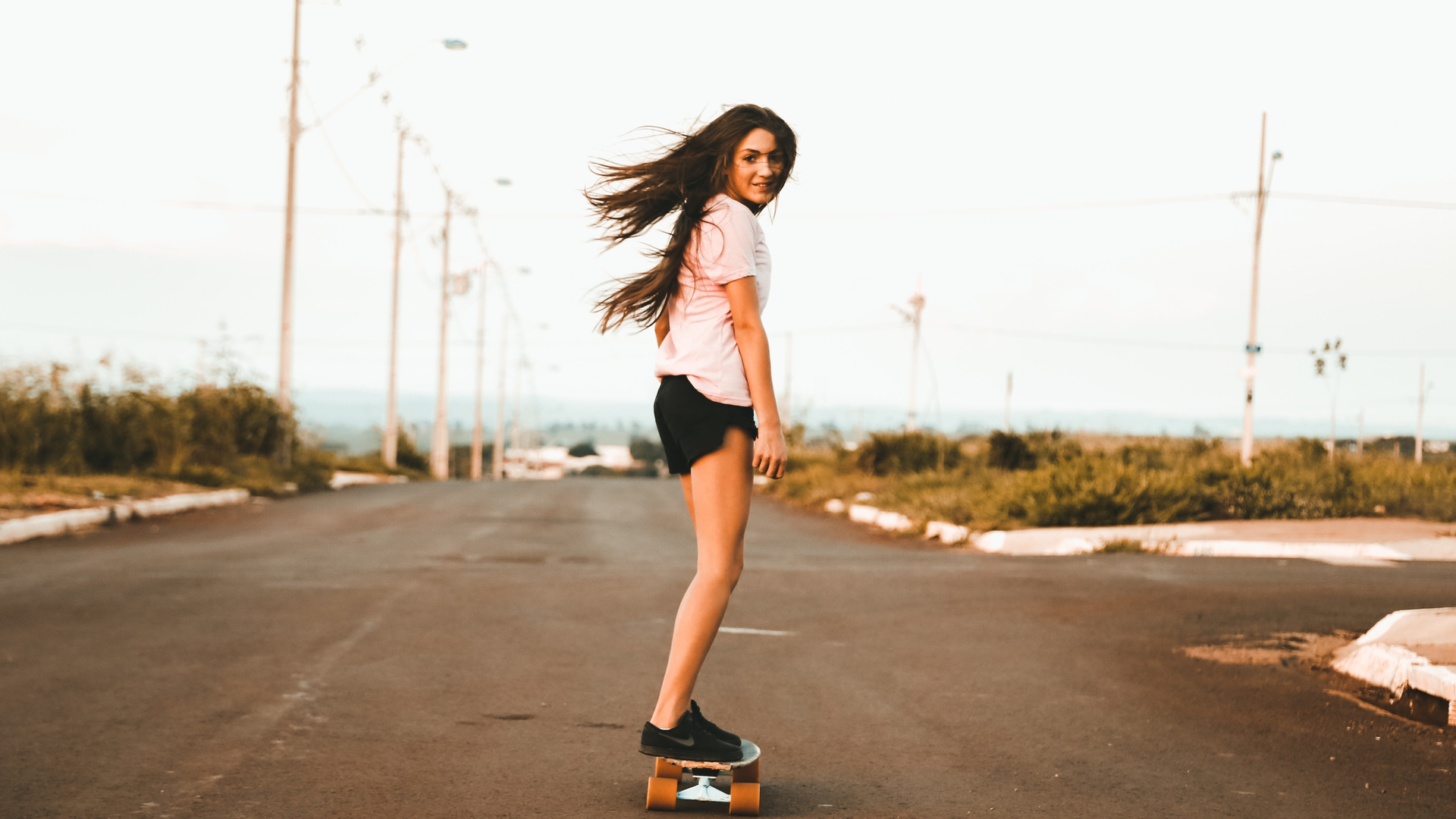 Woman Riding Skateboard At The Road 5k