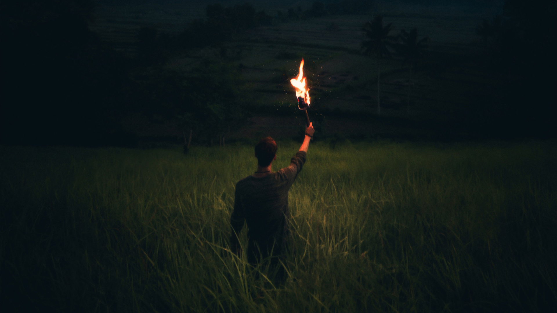 Man Through Dark With Wooden Torch