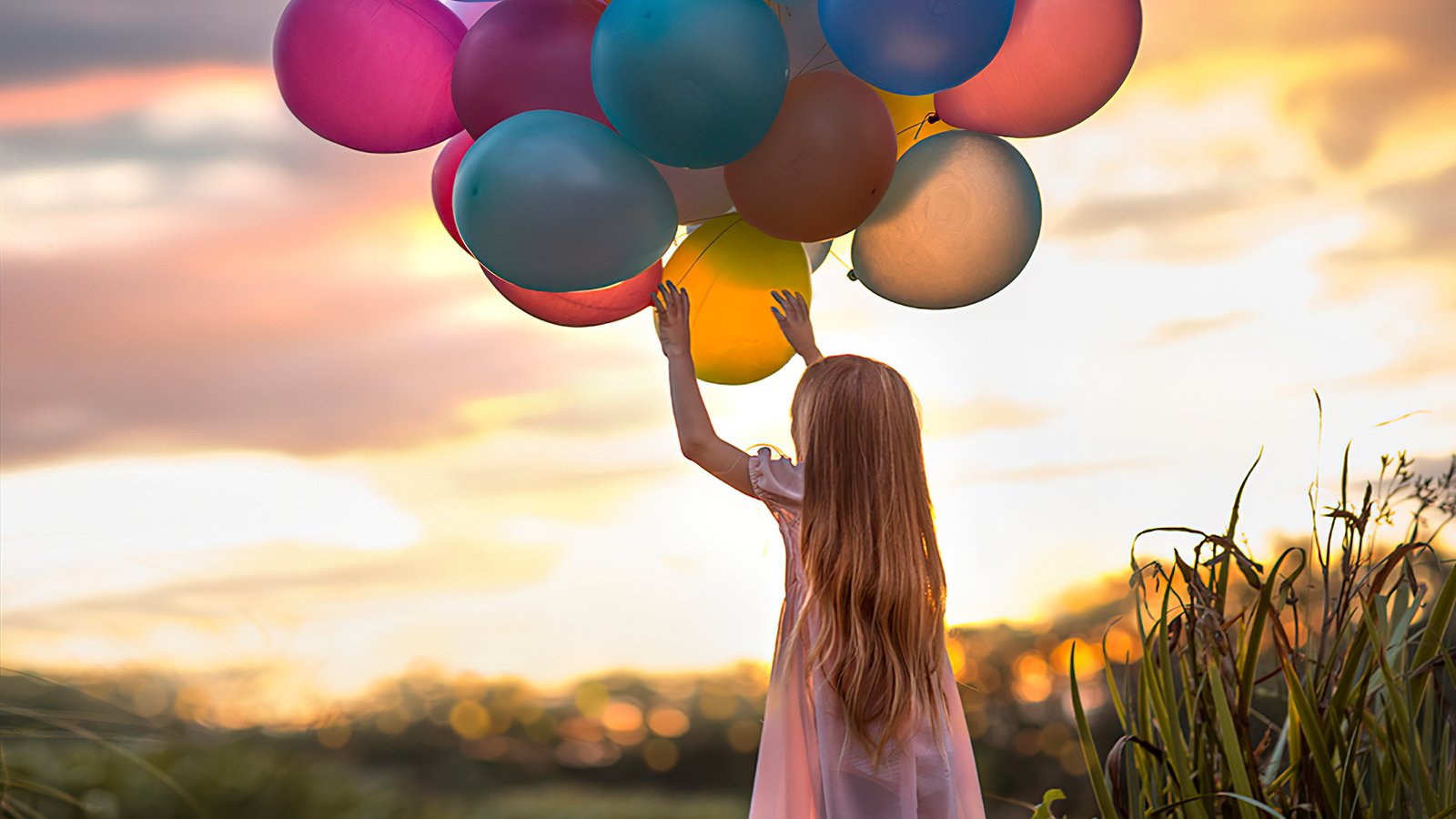 Little Girl With Colorful Balloons Wallpaper